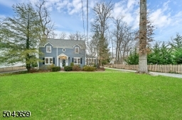 There is a charming stone driveway. There is a one car garage. The rear yard is level and great for any outdoor activities.