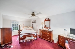 There are wood floors under the carpet. This room has 2 closets.