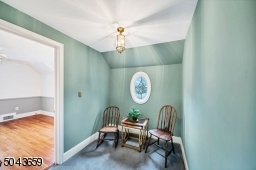 This is a wonder space for a home office desk. There is also a full staircase to the walk up attic.