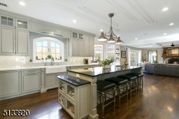 This is the ideal kitchen with professional grade appliances, lots of custom designed cabinetry, Quarts counters & farmhouse sink