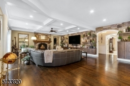 Stunning stone accent wall with custom built-in's