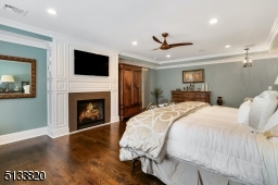 Gas fireplace and chandelier handing over sitting area