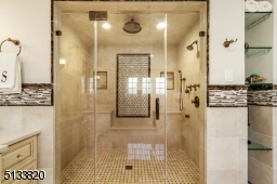Rain shower head, body sprays, regular shower head and handheld, built in seat. Separate commode room.