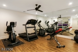 Features mirrored wall and built-in shelving