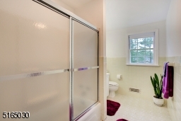 Third floor bath has shower and tub.
