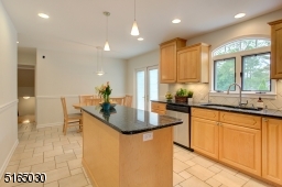 Kitchen has french doors leading to back deck