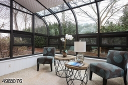 Glass Enclosed, Heated & Air Conditioned 4-Season Sunroom.