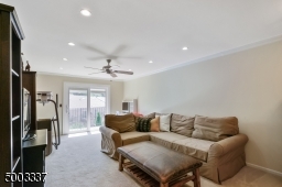 Sliding door to balcony, recessed lighting, ceiling fan