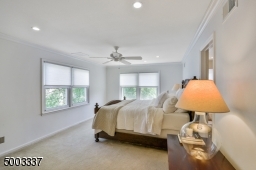 Spacious and bright master bedroom with 2 double windows, recessed lighting and ceiling fan