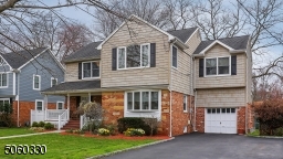 picture-perfect home. It features a covered front porch with plenty of room for rocking chairs.