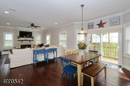Kitchen opens to family room area with Gas Fireplace