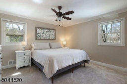 Freshly painted Master Bedroom with ceiling fan and 2 closets.