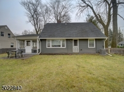 Backyard with patio and large grass area