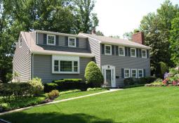 Lovely stone-walled summer garden beds create inviting surrounds and attractive curb appeal for this crisp Colonial Split home. Spacious rooms and a versatile floor plan offer easy, comfortable living.